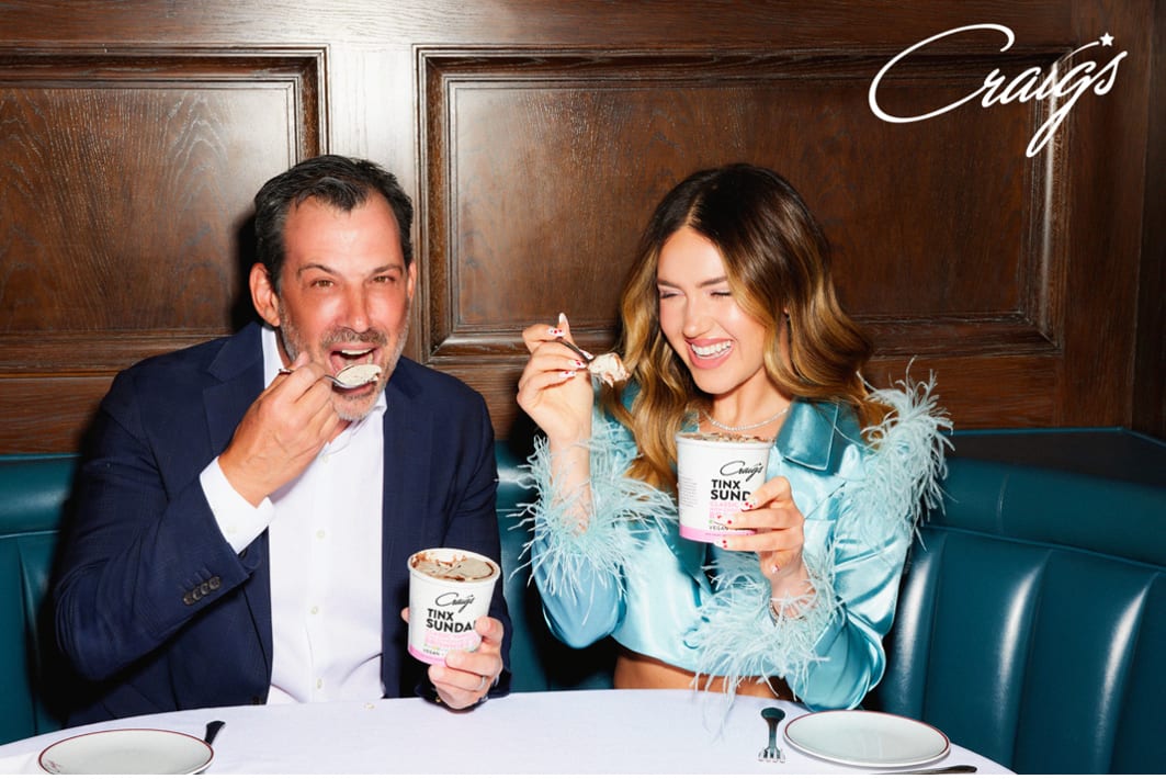 Facial expression, Picture frame, Smile, Tableware, Photograph, Drinkware, Table, Fashion, Gesture, Happy