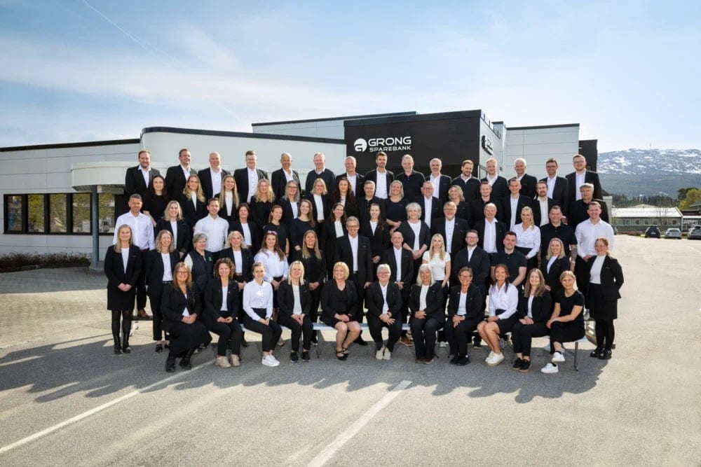Formal wear, Social group, White-collar worker, Suit trousers, Standing, Coat, Smile, Team