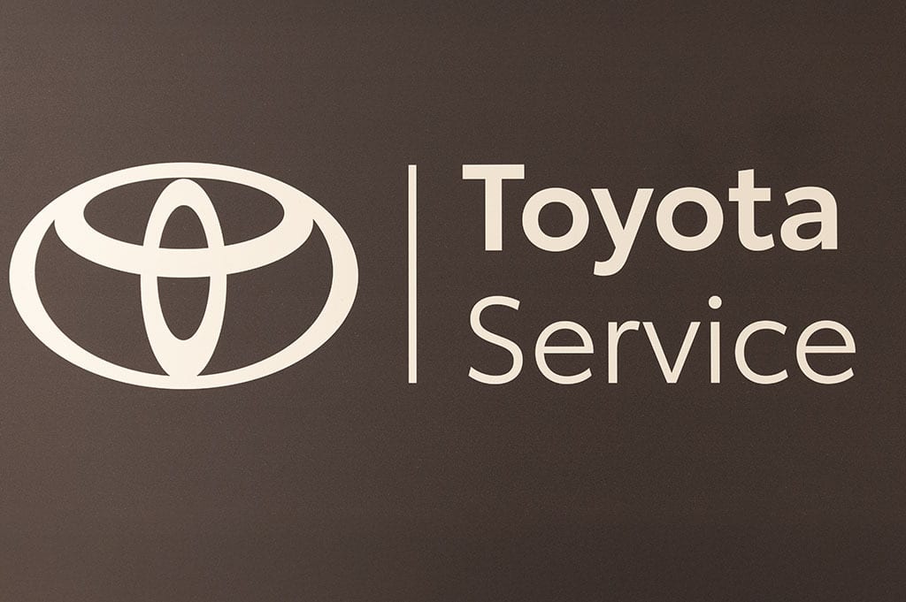 Toyota logo and "Toyota Service" text on a dark background.