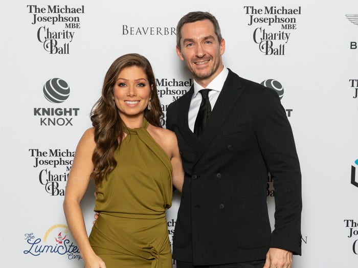 Formal wear, Facial expression, Smile, Event, Happiness, Dress, Collar, Suit, Coat, Tuxedo