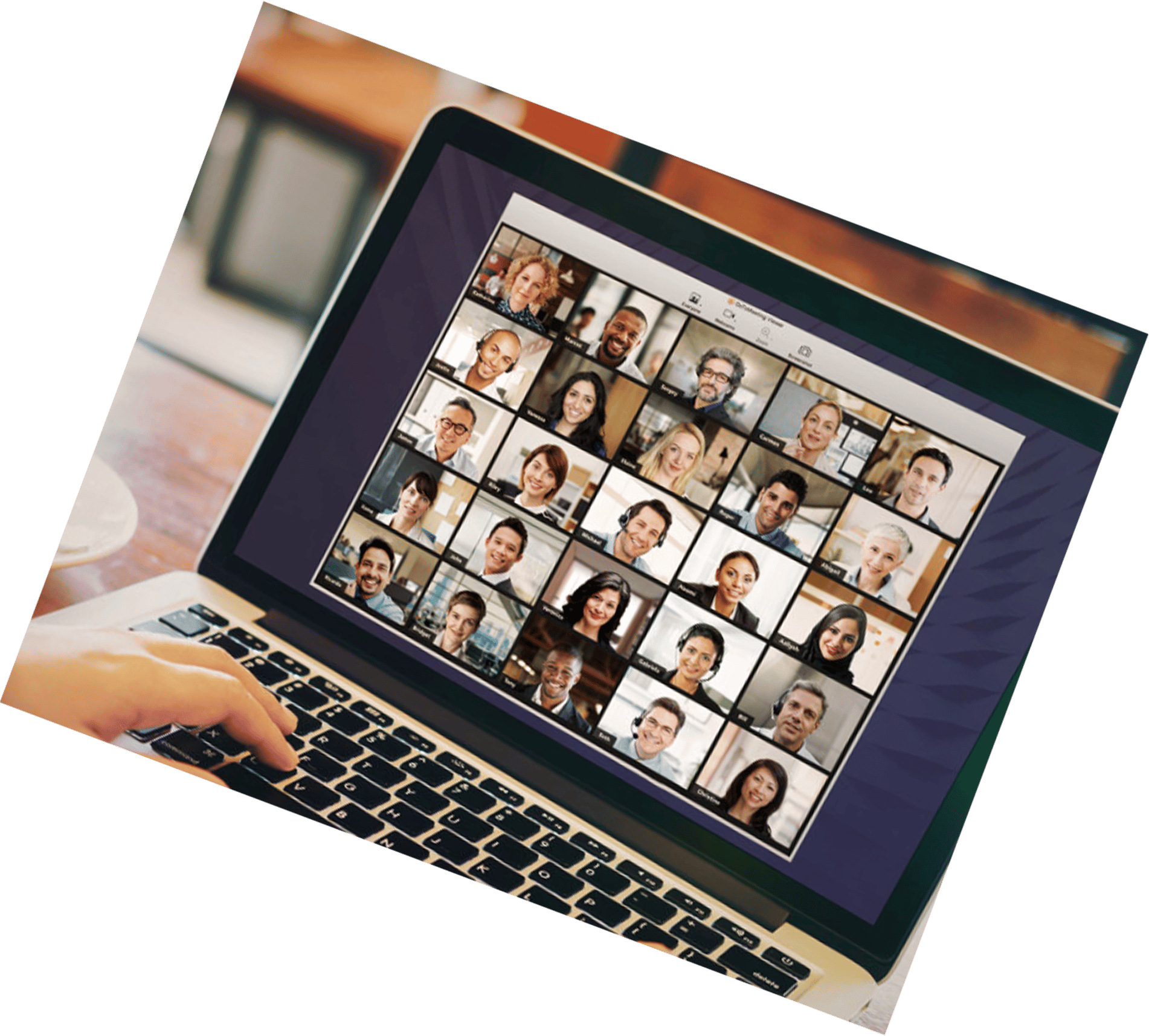 A hand typing on a laptop displaying a video conference with multiple participants.
