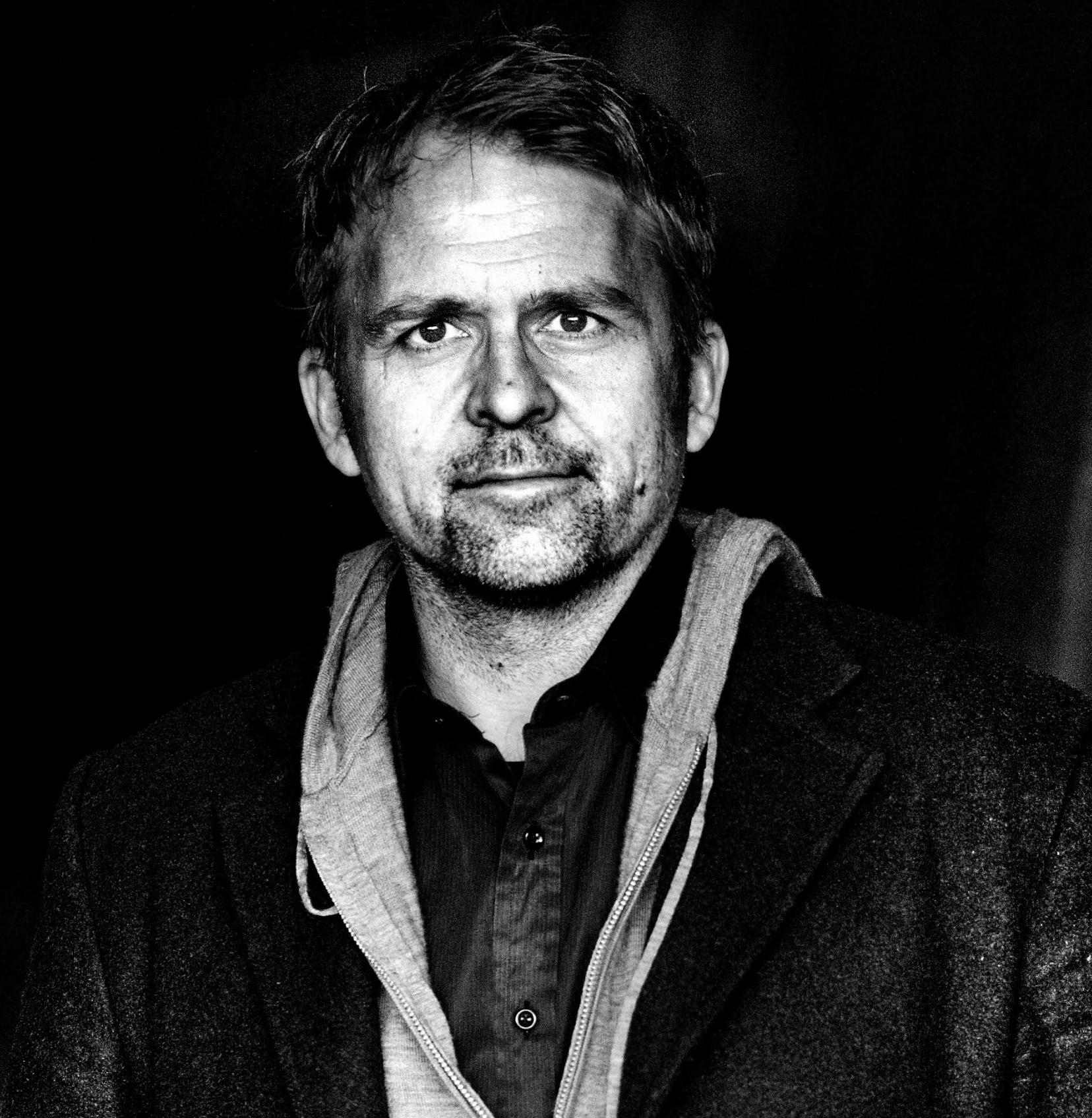 Flash photography, Facial hair, Clothing, Forehead, Chin, Outerwear, Beard, Jaw, Collar, Black-and-white