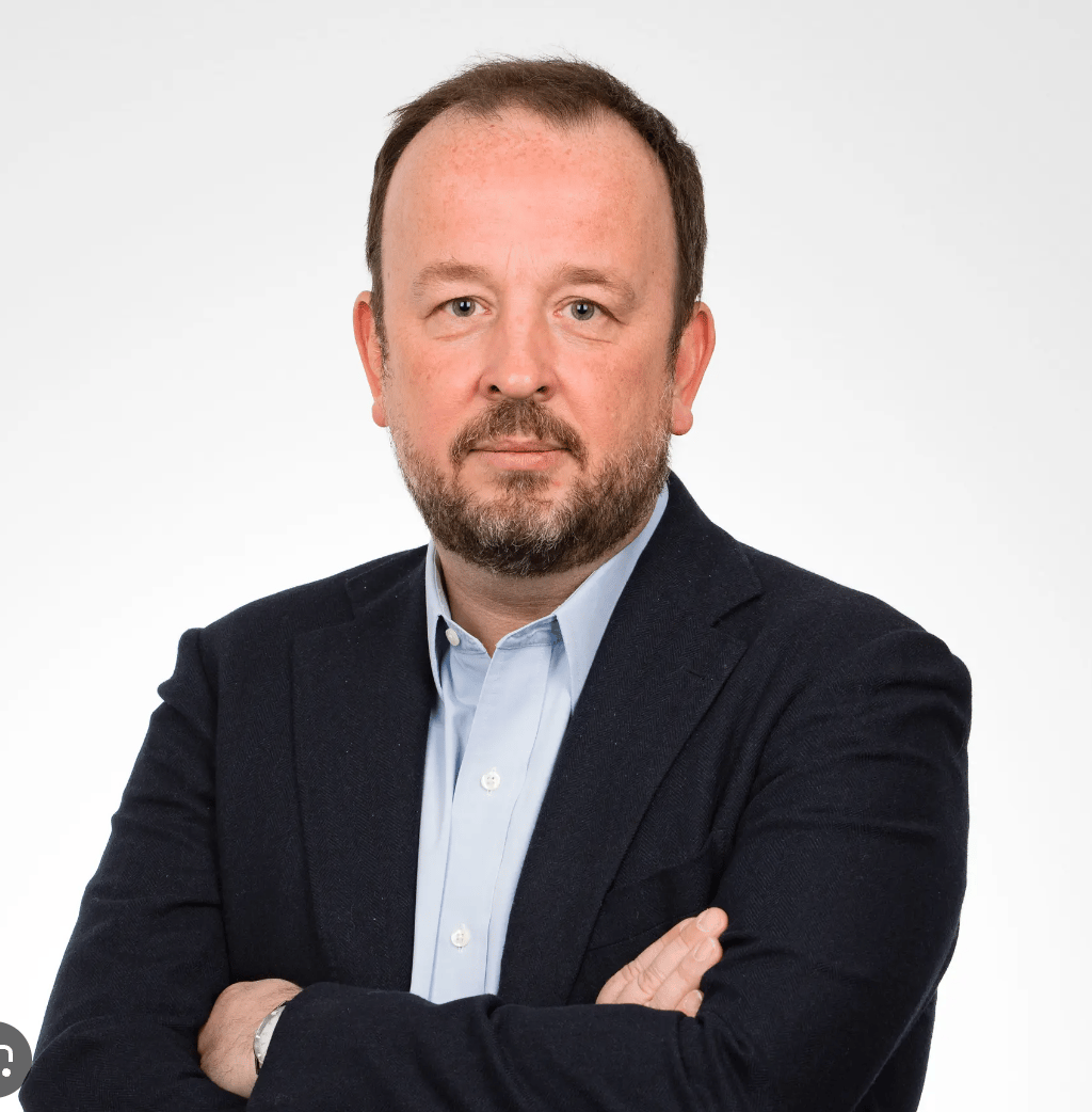 Dress shirt, Chin, Beard, Coat, Sleeve, Gesture, Collar