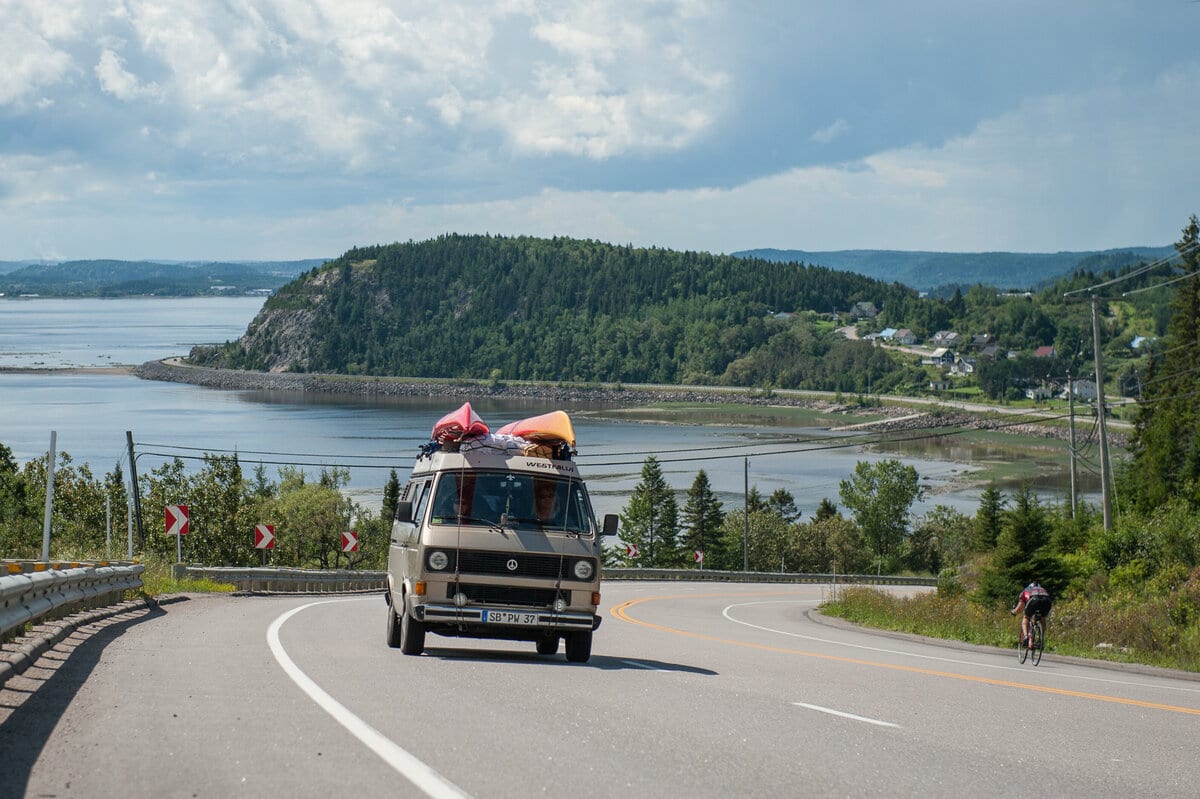 Motor vehicle, Road surface, Cloud, Water, Sky, Tire, Plant, Wheel, Mountain