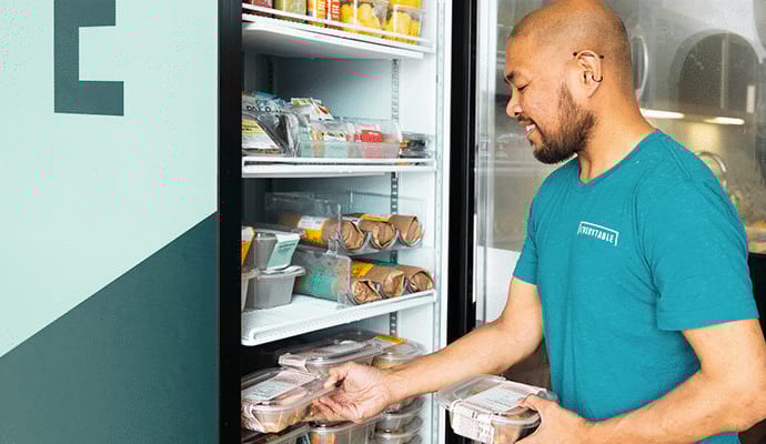 Person restocking the MiniMarket fridge
