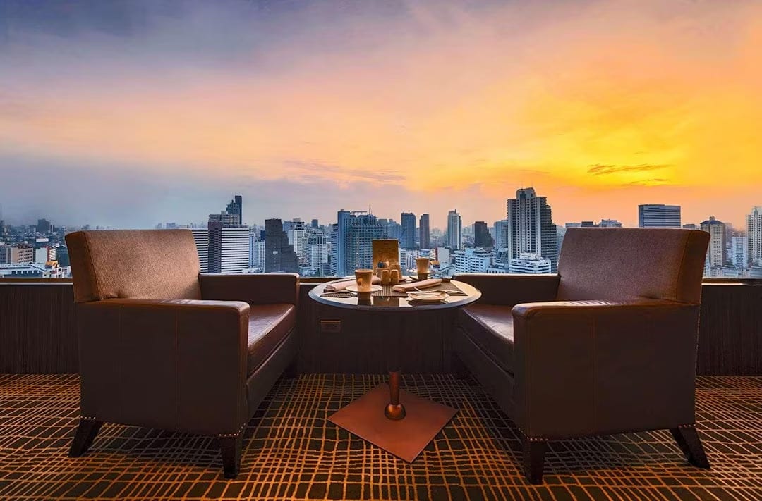 Tower block, Outdoor furniture, Cloud, Sky, Building, Skyscraper, Table, Wood, Afterglow, Condominium