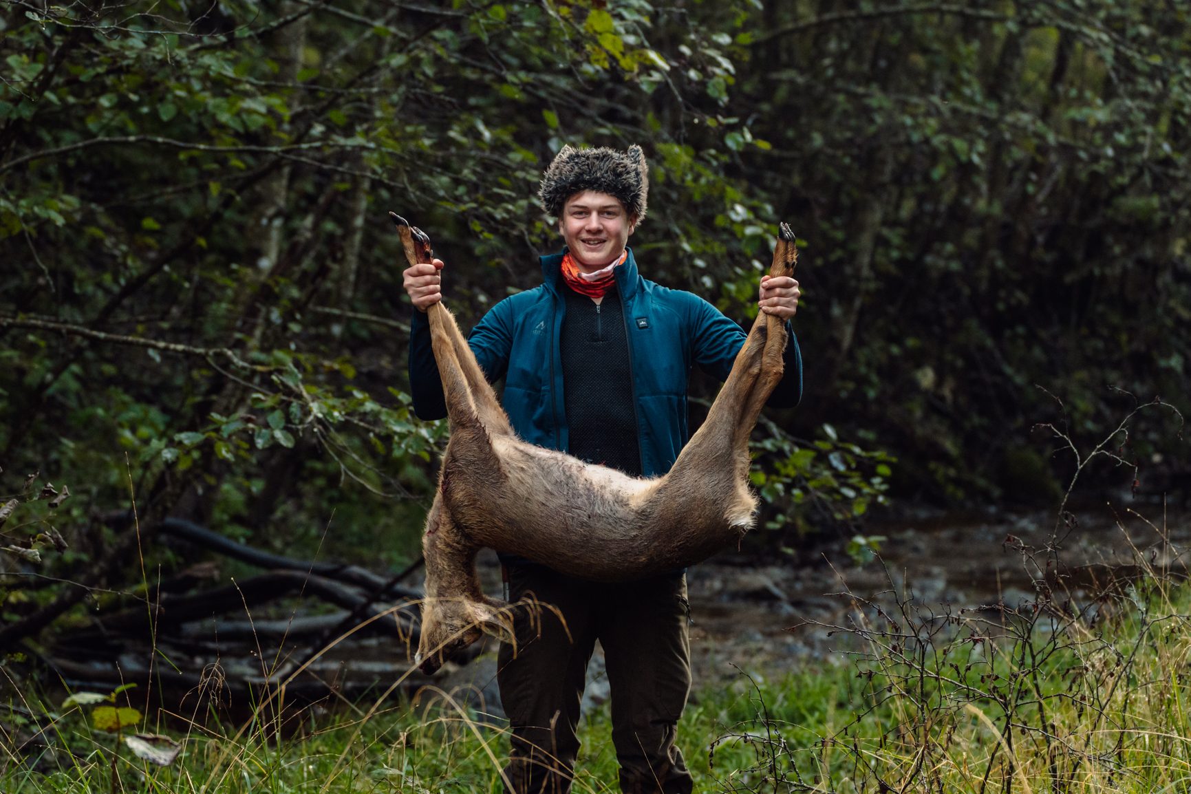 Natural landscape, Terrestrial plant, Smile, Jaw, Wood, Tree, Fawn