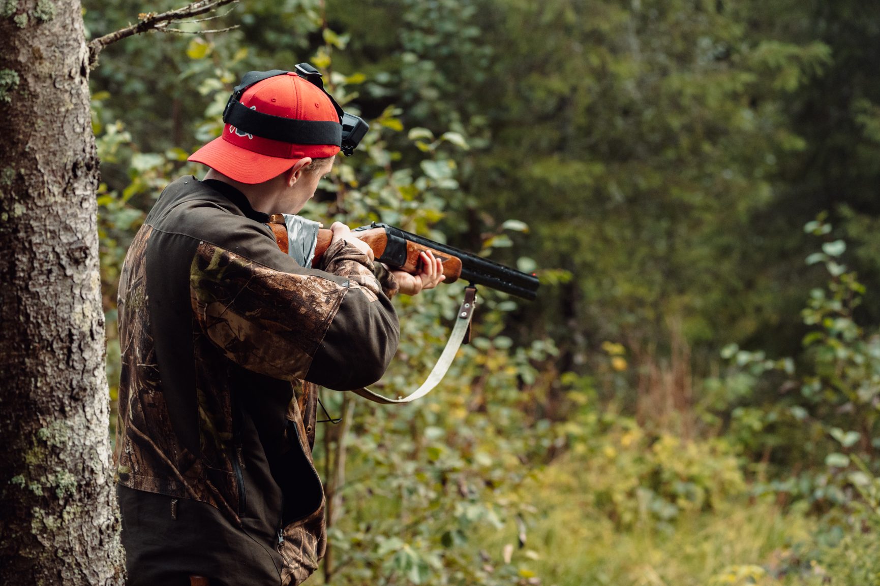 Military camouflage, Outdoor recreation, Baseball cap, Plant, Glove, Tree, Marines, Shotgun