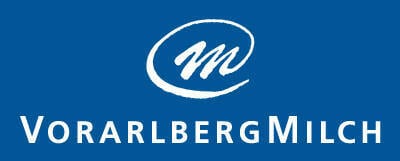 Vorarlberg Milch logo: white stylized M in an oval and "VORARLBERG MILCH" text on a blue background.