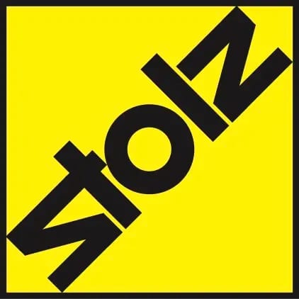 Diagonal black "STOLZ" text on a bright yellow square background.