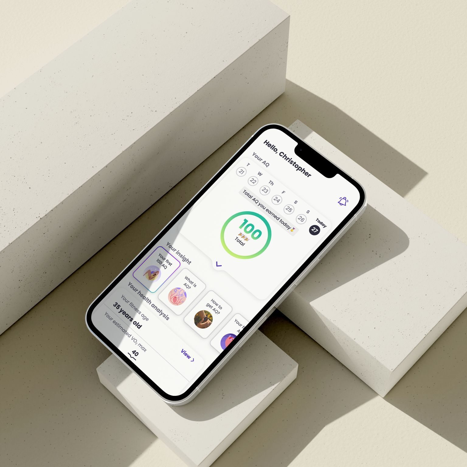 Smartphone displaying a health app with AQ score and fitness age, on concrete blocks.