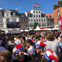 Public space, Building, Sky, World, Product, Window, Human, Hat, Fan, Tree