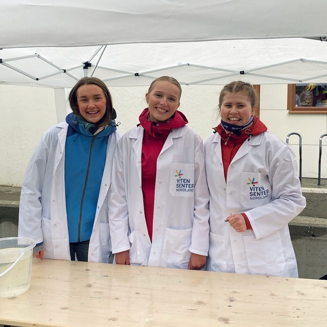 White coat, Smile, Table, Sleeve, Workwear, Jacket