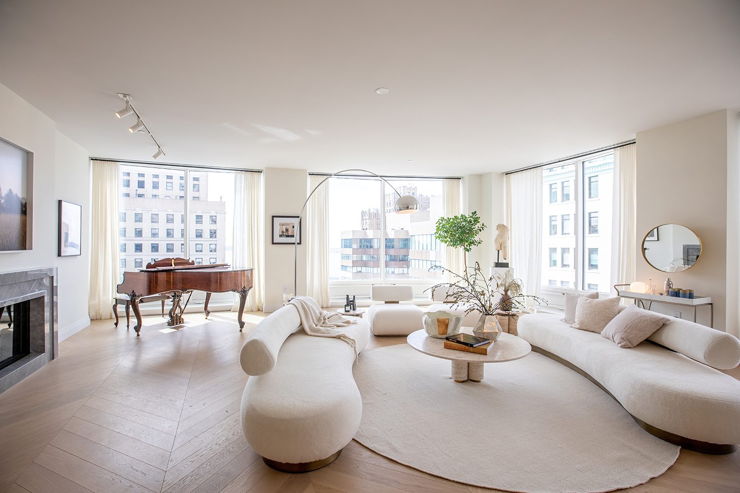 Picture frame, Interior design, Living room, Furniture, Couch, Building, Table, Window, Lighting, Plant