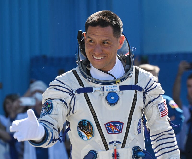Sports uniform, Smile, Gesture, Astronaut, Helmet