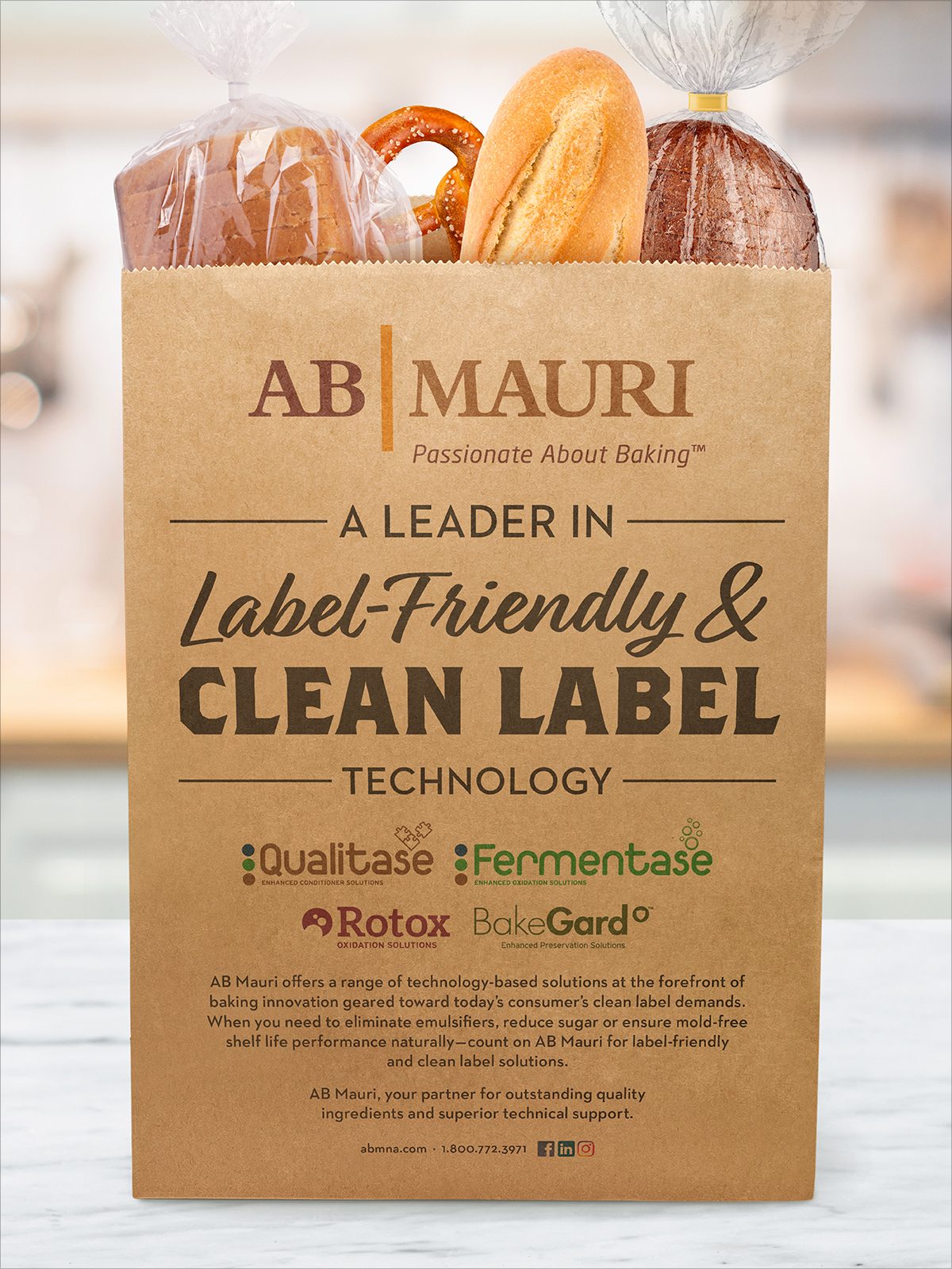AB Mauri paper bag filled with baked goods, promoting label-friendly and clean label baking technology.