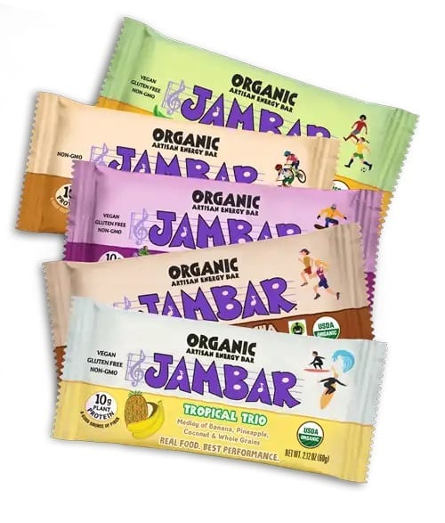 Stack of five organic JamBar energy bars in various flavors and colorful packaging, showing vegan and gluten-free claims.
