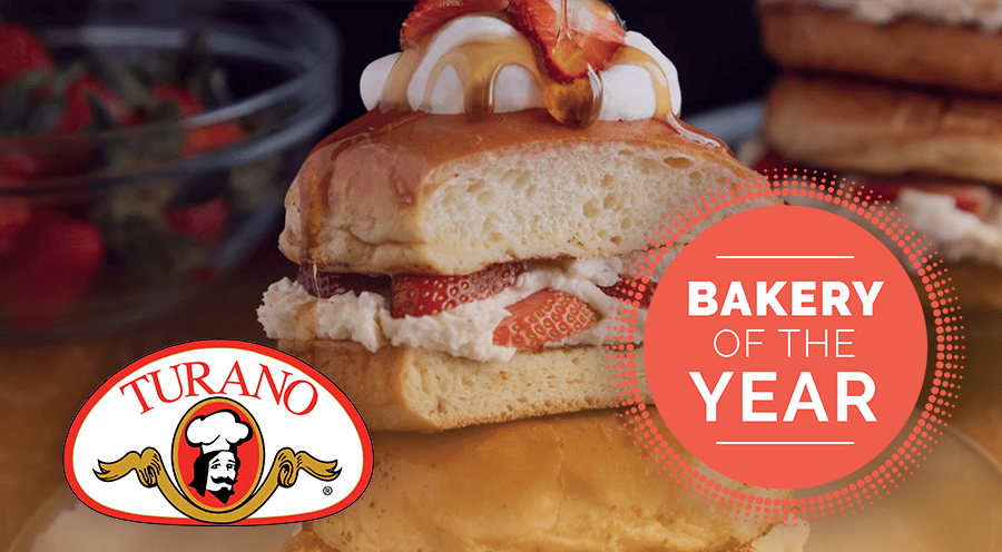 Turano strawberry dessert with cream, syrup, and "Bakery of the Year" award text.