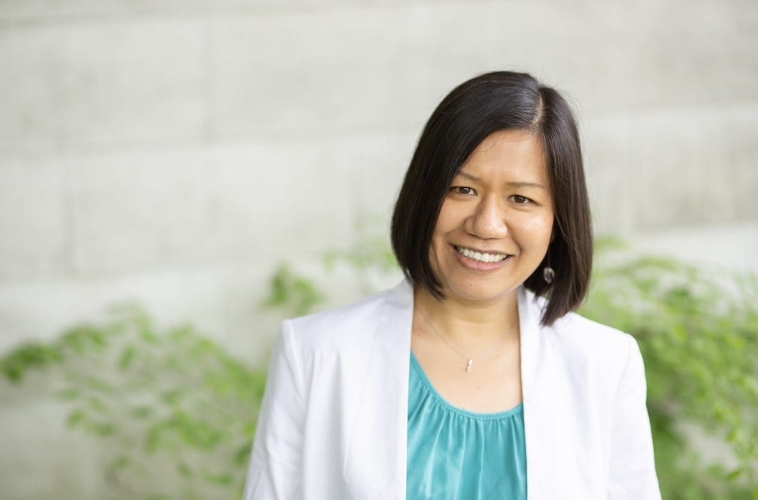 Photography, Smile, Lab coat, Building wall, Ivy