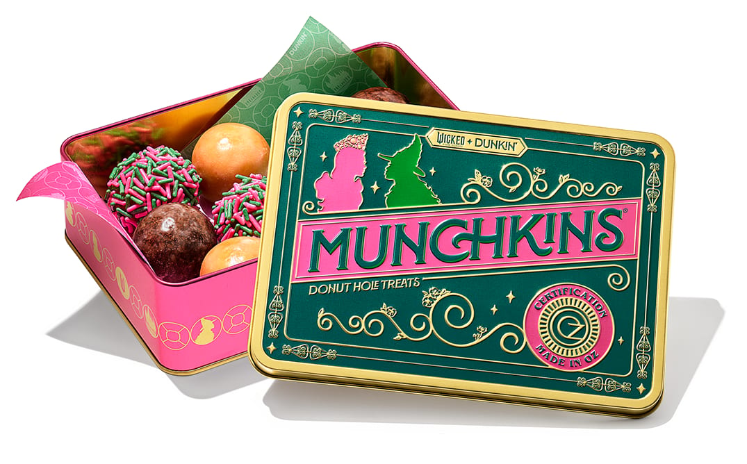 "WICKED + DUNKIN' MUNCHKINS" green and pink tin box filled with donut holes.