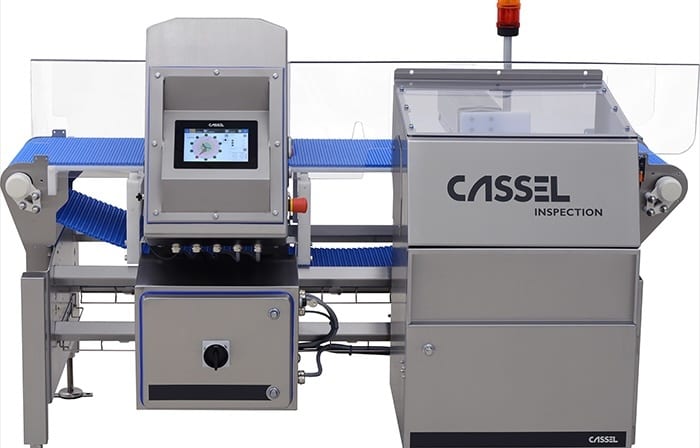A Cassel Inspection conveyor belt system with a control screen, used for product inspection.