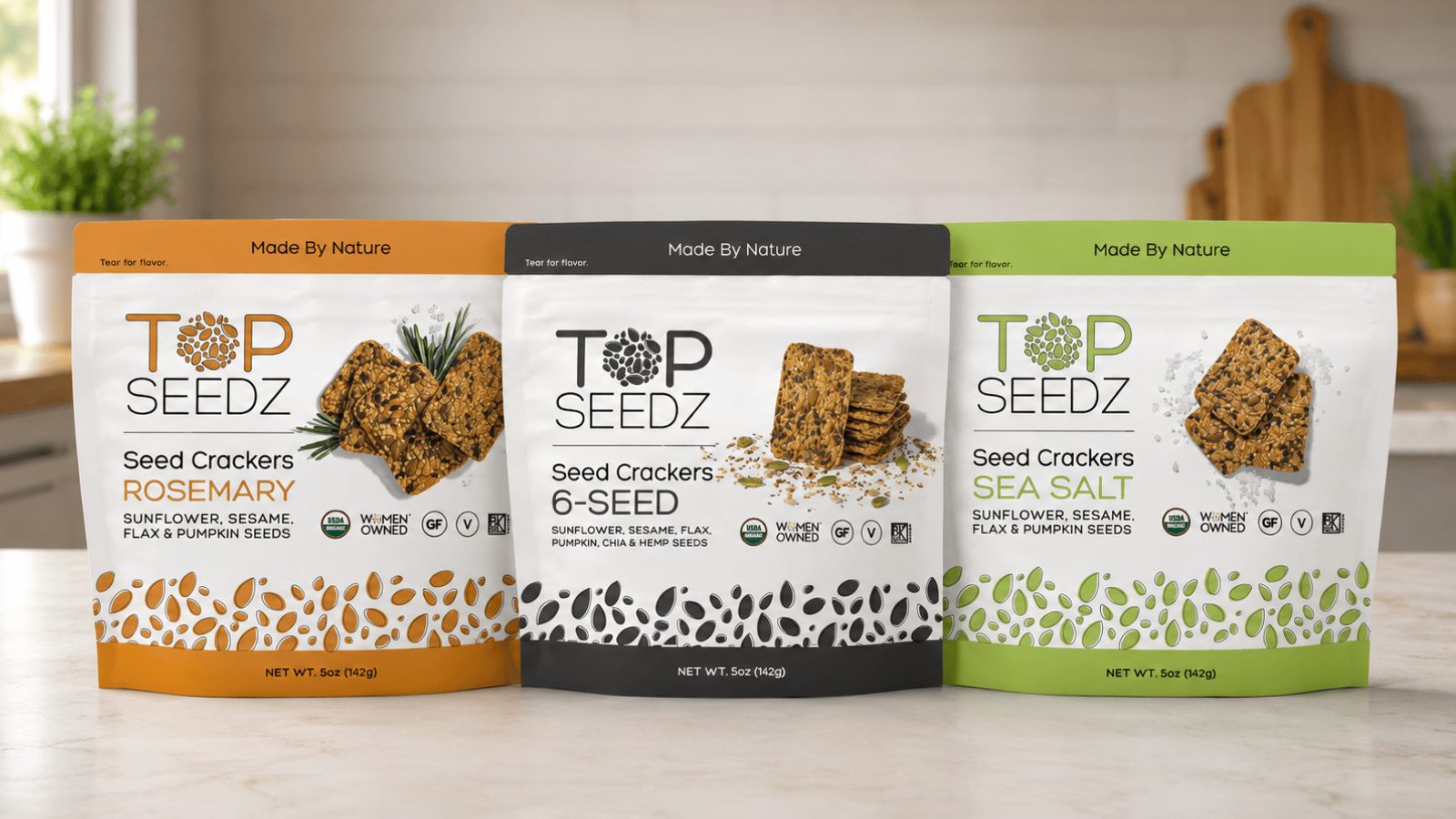 Three packages of Top Seedz Seed Crackers: Rosemary, 6-Seed, and Sea Salt flavors.