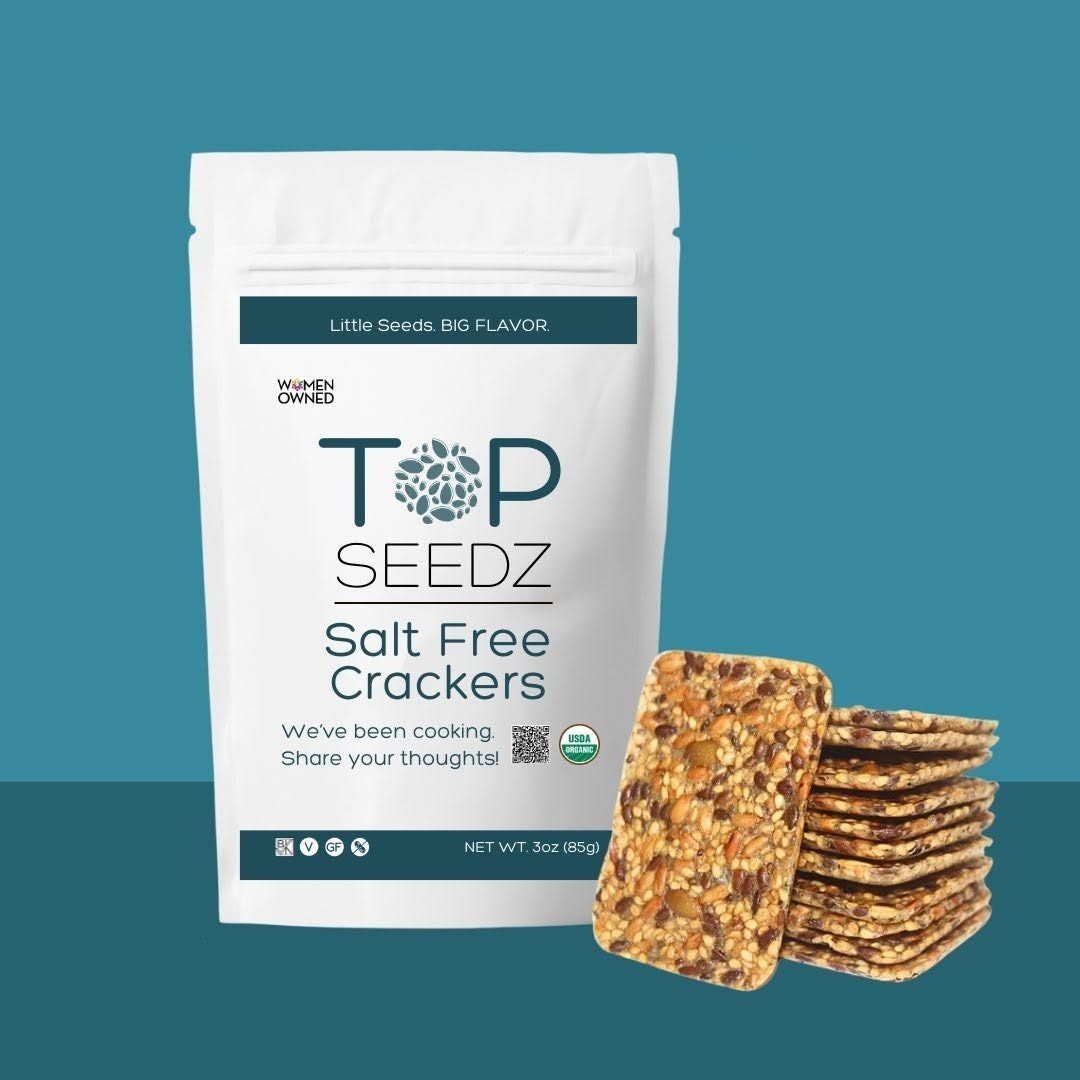 TOP SEEDZ Salt Free Crackers pouch, "Little Seeds. BIG FLAVOR." and "WOMEN OWNED", with a cracker stack.
