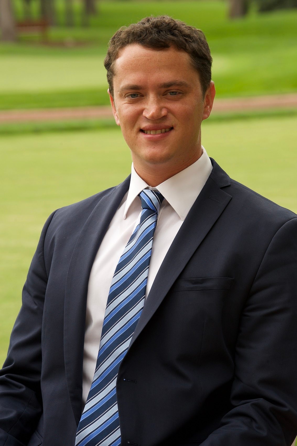 Dress shirt, Head, Outerwear, Smile, Vertebrate, Coat, Sleeve, Tie, Mammal, Gesture