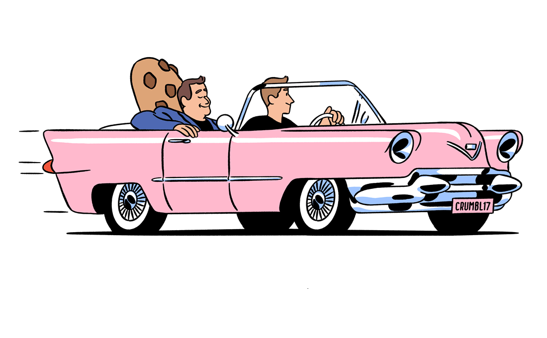 Two men and a giant chocolate chip cookie ride in a pink convertible, license plate 'CRUMBL17'.