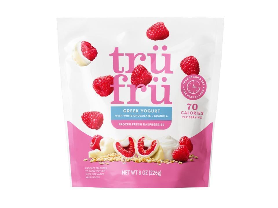 Tru Fru frozen fresh raspberries with Greek yogurt, white chocolate, and granola in a pink and white bag.