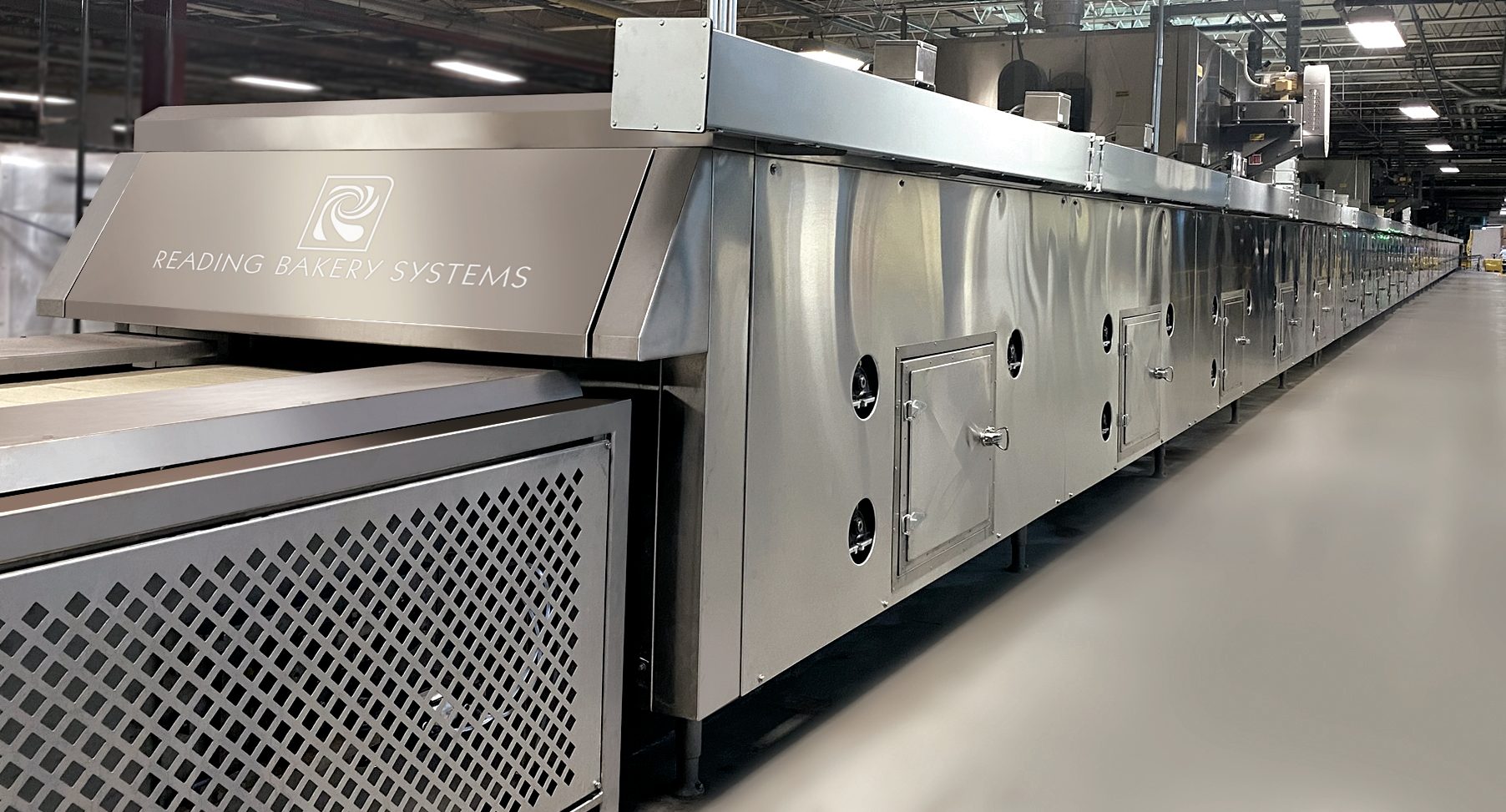 Long, stainless steel industrial baking oven from Reading Bakery Systems.