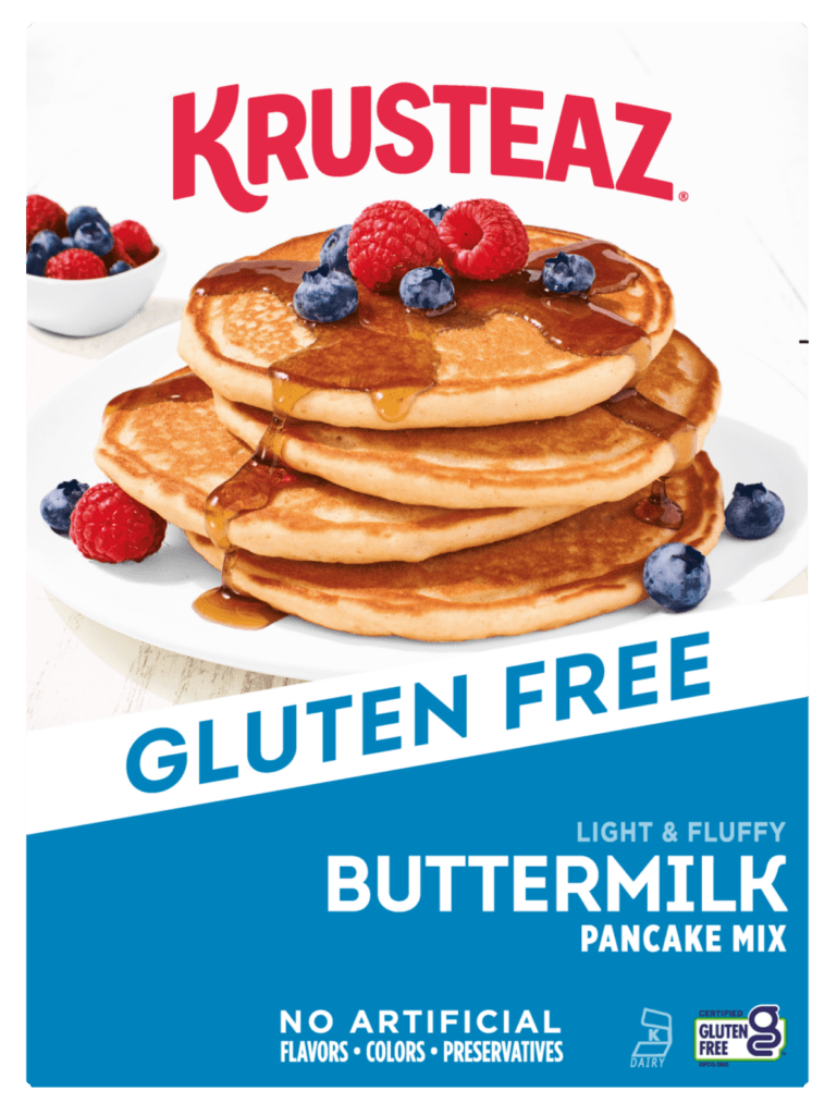 Krusteaz Gluten Free Buttermilk Pancake Mix box with a stack of pancakes and berries.