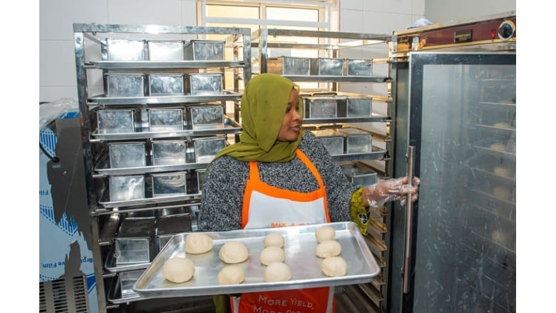 Food, Tableware, Head wrap, Apron, Tray with dough, Proving racks
