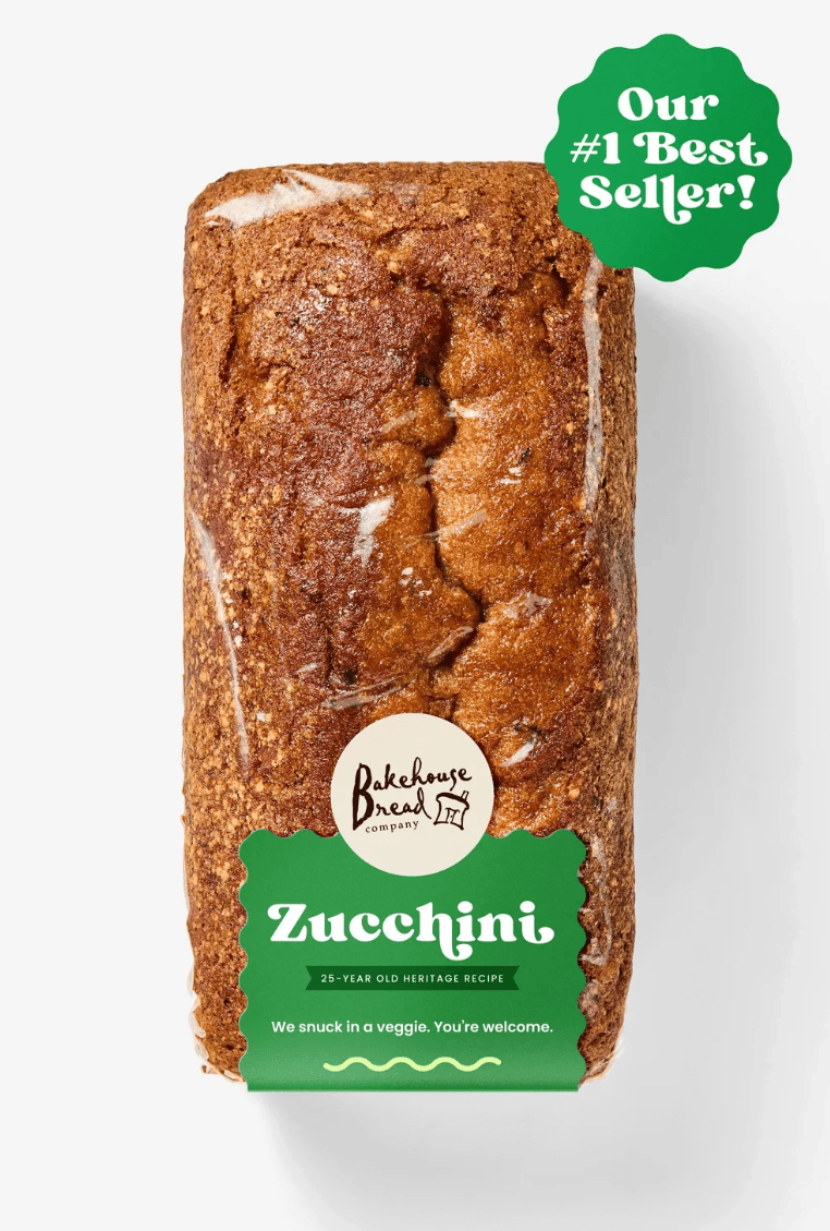 Bakehouse Zucchini bread loaf with a green label and "#1 Best Seller!" tag.