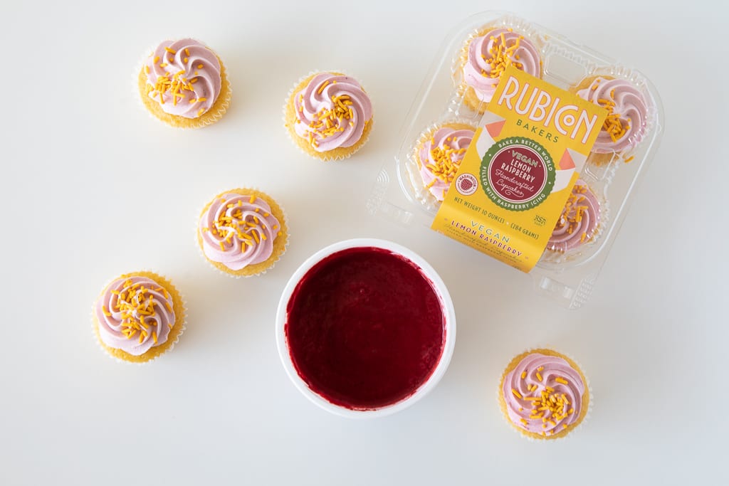 Cupcakes, clamshell tray, bowl of raspberry puree
