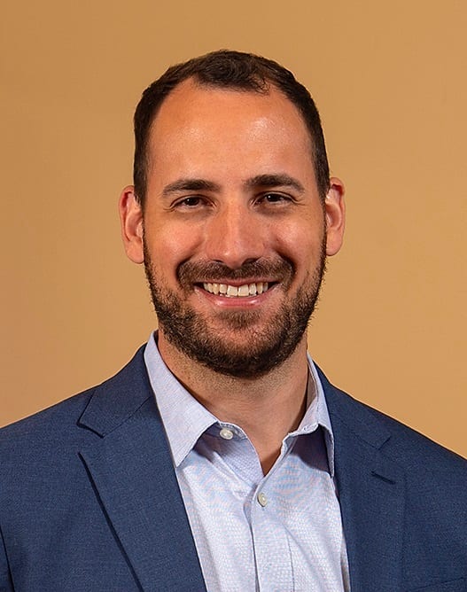 Dress shirt, Forehead, Smile, Chin, Eyebrow, Beard, Jaw, Gesture, Collar