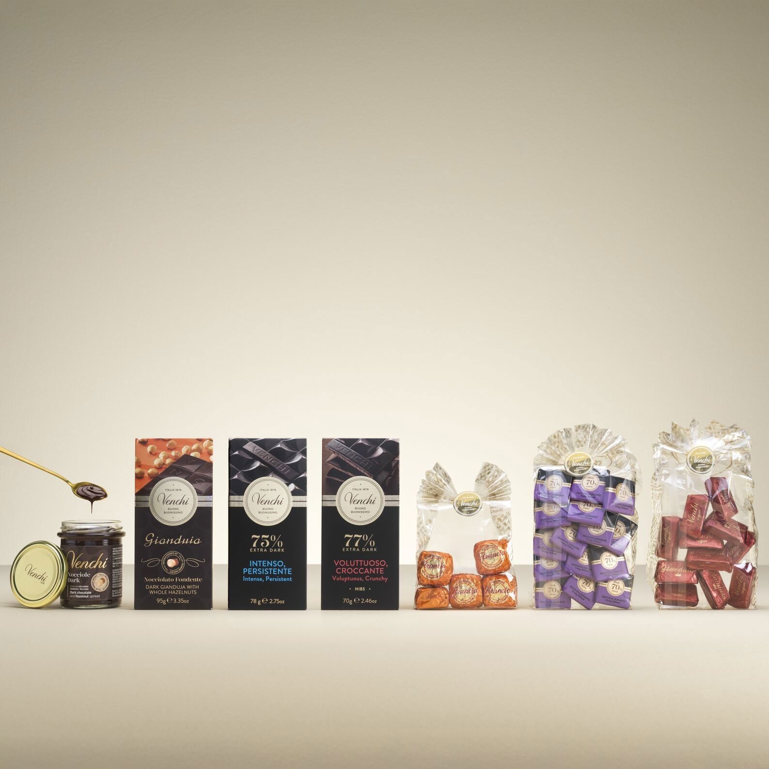Venchi chocolate spread, bars (Gianduia, 75%, 77% Extra Dark), and bagged chocolates on a light background.