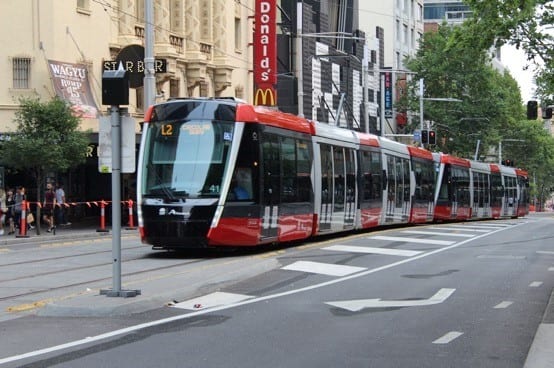 Mode of transport, Automotive lighting, Rolling stock, Train, Window, Vehicle, Building, Track, Tree, Electricity