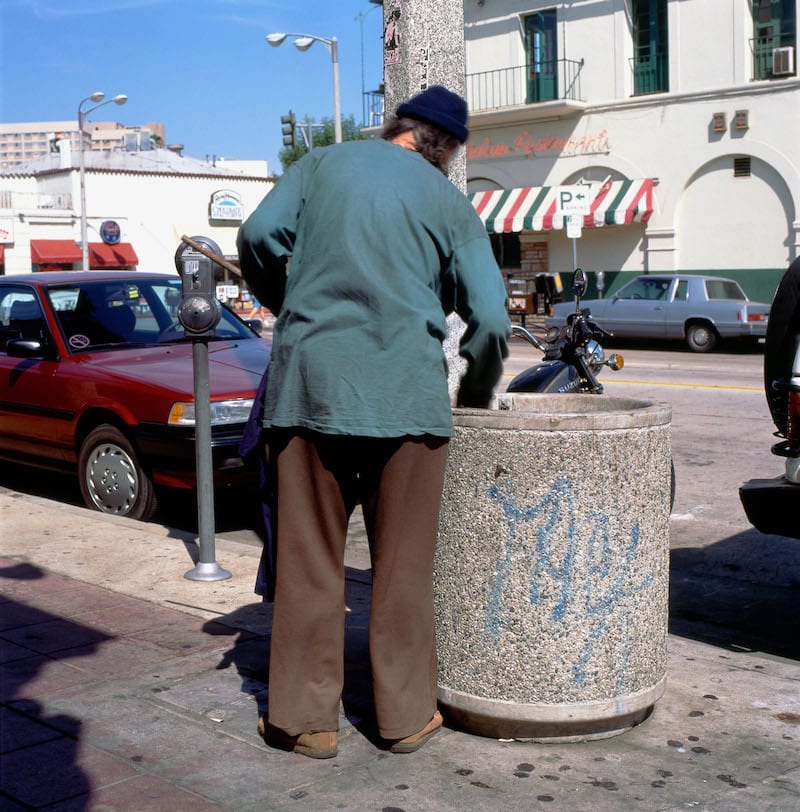 A Homeless Man Looking Through A Garbage Can Bin In Affluent Area Of Westwood Village Los Angeles Web (1)
