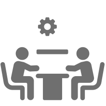 Icon: Two people meeting at a table, gear above.