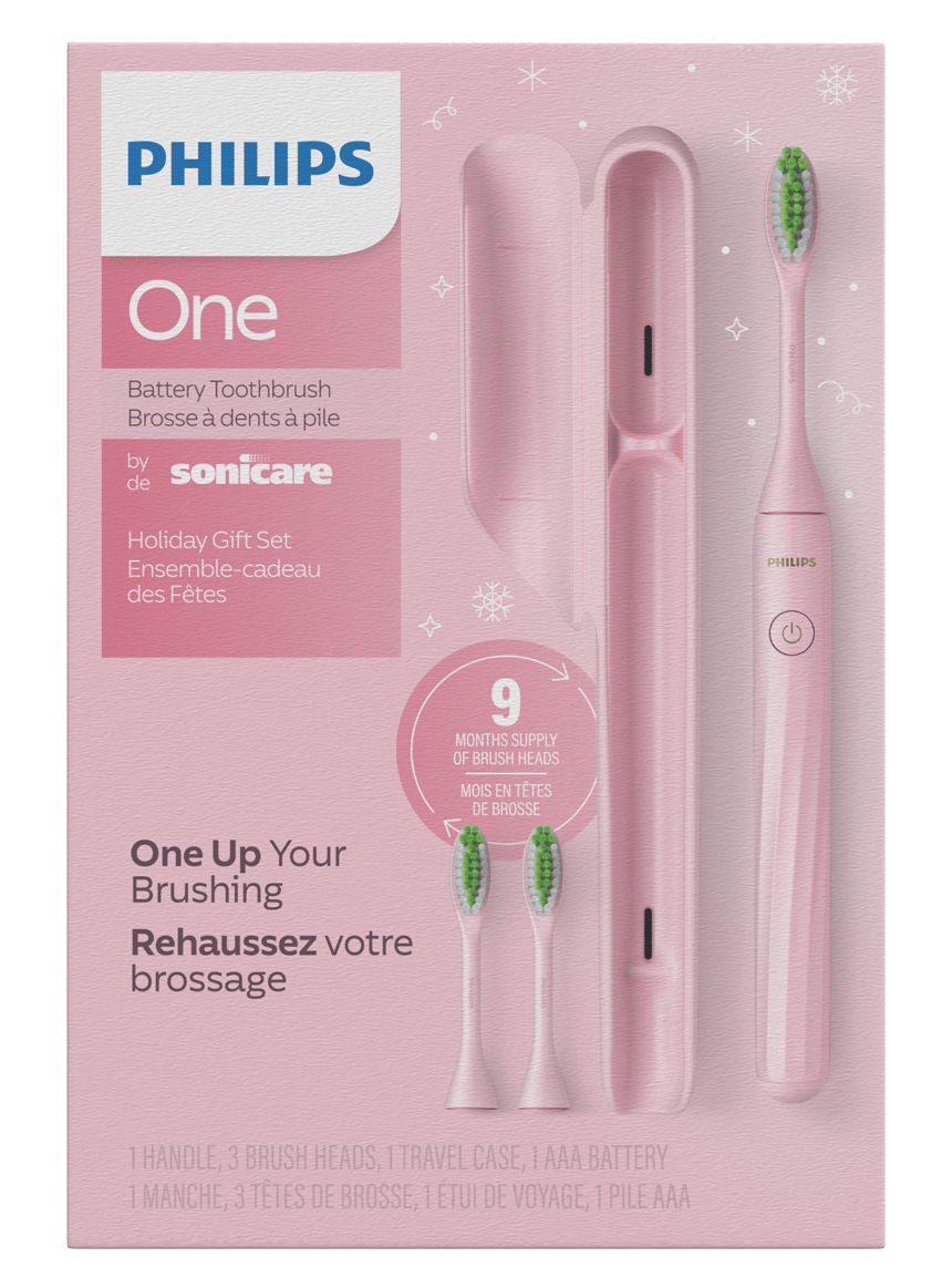 Pink Philips One by Sonicare battery toothbrush holiday gift set, with 9-month brush head supply.