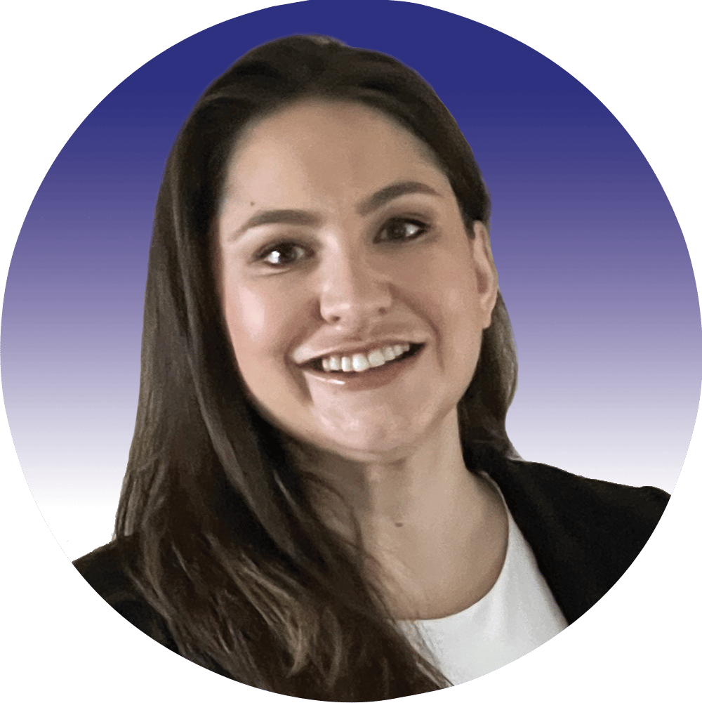 Smiling woman in professional headshot, long dark hair, blazer.