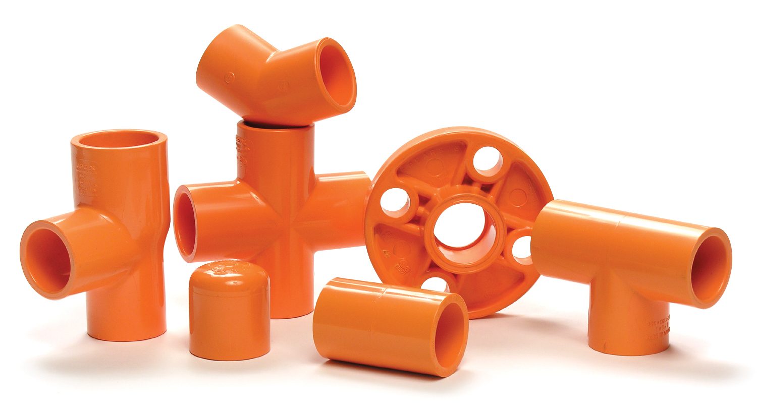 Various orange PVC pipe fittings: tees, elbows, a cap, a coupling, and a flange on white.