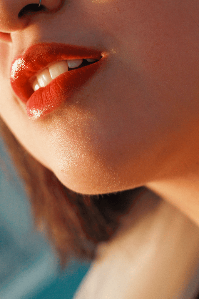 Human body, Lip, Lipstick, Eyelash, Jaw, Neck, Orange, Gesture, Waist