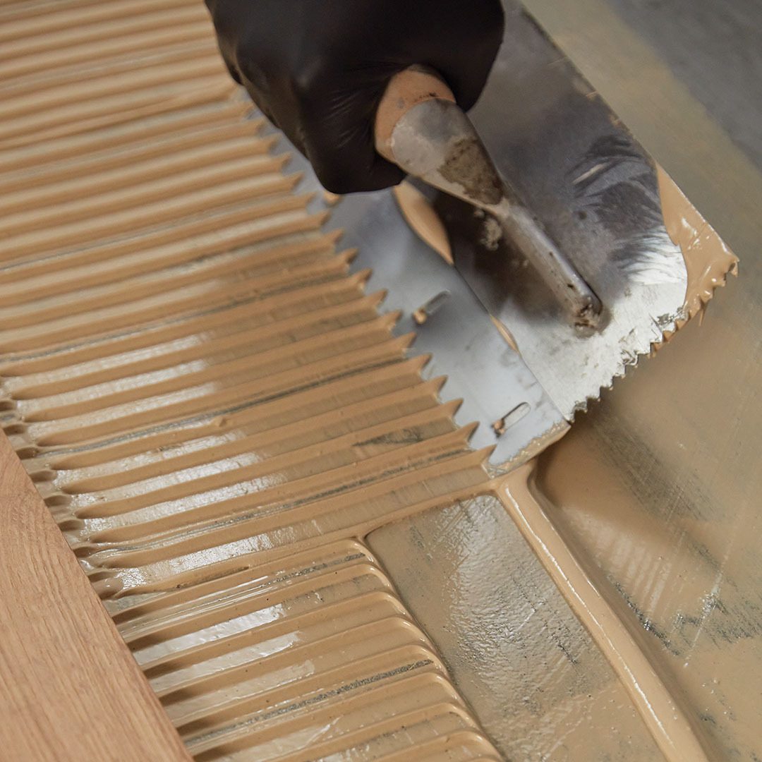 Ultrabond ECO 987, MAPEI, premium, single-component, heavy-body wood-flooring adhesive, hybrid-polymer, formulation free from water, solvents, amines, isocyanates, phthalate plasticizers, and epoxy resins