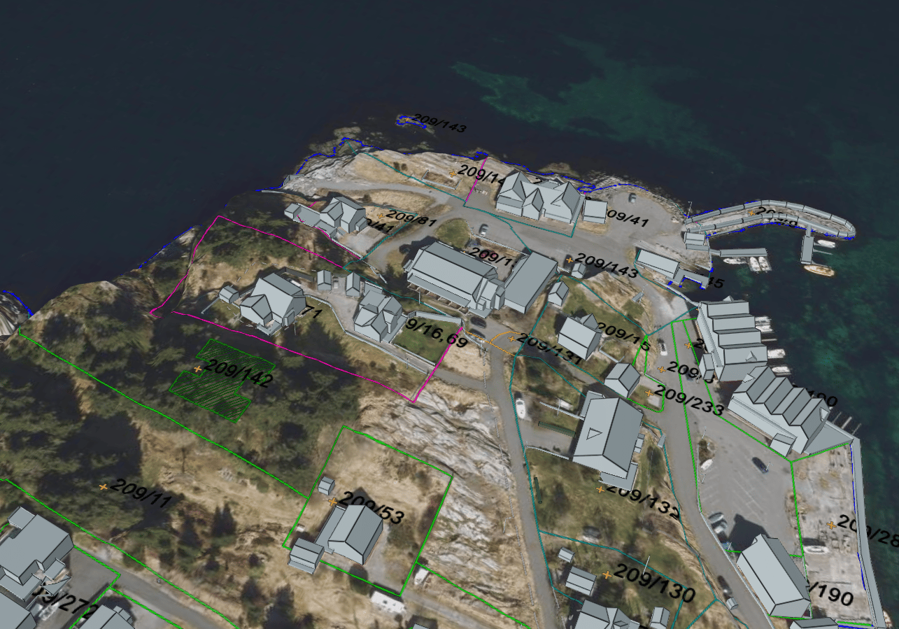 Aerial cadastral map of a coastal area with 3D buildings, roads, and numbered parcels.