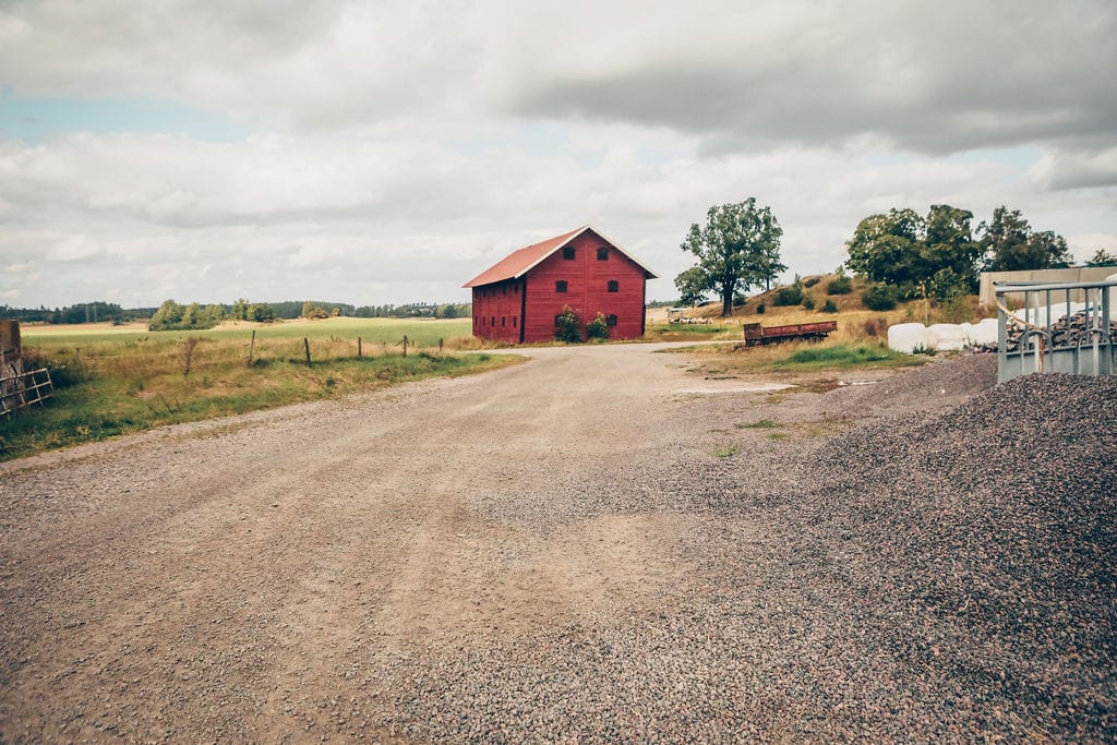 Road surface, Land lot, Natural landscape, Cloud, Sky, Plant, House, Asphalt, Wood, Tree