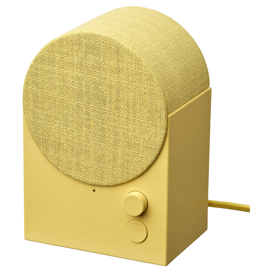 Yellow speaker with cylindrical fabric top and two control knobs.