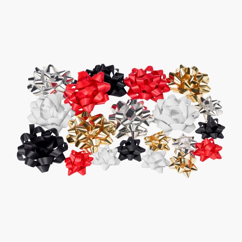 Scattered red, black, gold, silver, and white gift bows in various sizes.