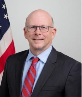 Dress shirt, Glasses, Smile, Flag, Tie, Sleeve, Gesture, Collar